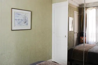 Un ou plusieurs lits dans un hébergement de l'établissement Lovely Paris flat close to Eiffel Tower