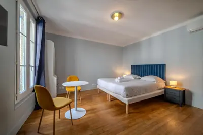 Un ou plusieurs lits dans un hébergement de l'établissement Majestic Suite