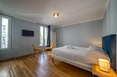 Un ou plusieurs lits dans un hébergement de l'établissement Majestic Suite