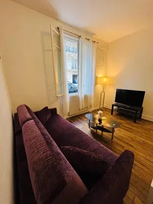 Coin salon dans l'établissement Appartement Boucicaut Tour Eiffel