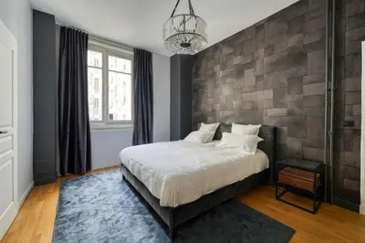 Un ou plusieurs lits dans un hébergement de l'établissement AV Experiences - Appartement Bugeaud Luxury