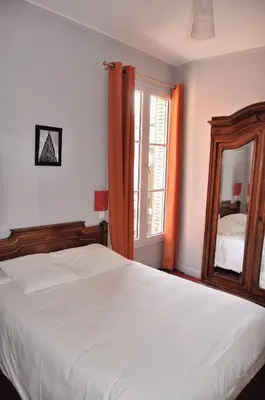 Un ou plusieurs lits dans un hébergement de l'établissement Hôtel Verlaine