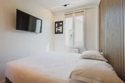 Un ou plusieurs lits dans un hébergement de l'établissement Charming Appt - 1BDR 4P - Saint Ouen