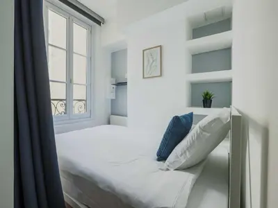 Un ou plusieurs lits dans un hébergement de l'établissement Modern apartment -1BR-3P-Ternes
