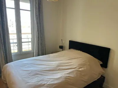 Un ou plusieurs lits dans un hébergement de l'établissement L'élégance à la Parisienne