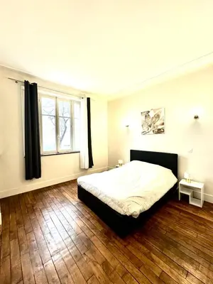 Un ou plusieurs lits dans un hébergement de l'établissement Appartements Auteuil Paris 16