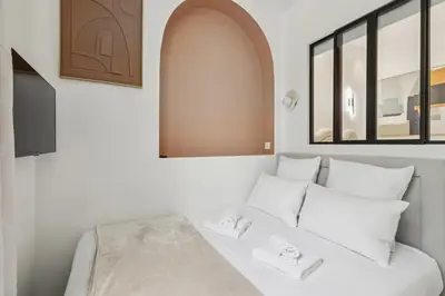 Un ou plusieurs lits dans un hébergement de l'établissement Appartement Guersant Pereire
