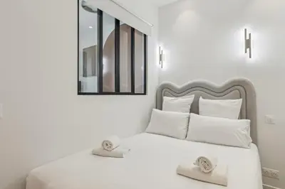 Un ou plusieurs lits dans un hébergement de l'établissement Appartement Guersant Pereire