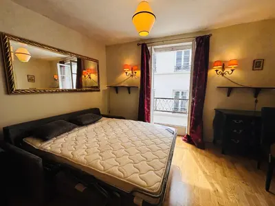 Un ou plusieurs lits dans un hébergement de l'établissement Studio 150m to Notre Dame