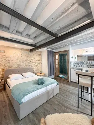 Un ou plusieurs lits dans un hébergement de l'établissement Studio Cosy Paris Centre République Marais