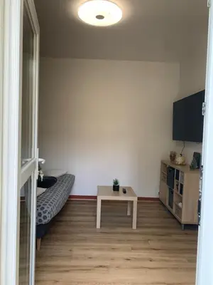 Télévision ou salle de divertissement dans l'établissement appartement RDC gauche