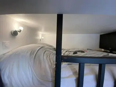 Un ou plusieurs lits dans un hébergement de l'établissement Studio au cœur de paris