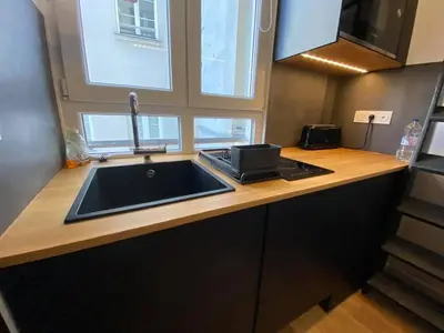 Cuisine ou kitchenette dans l'établissement Studio au cœur de paris