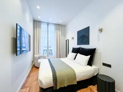 Un ou plusieurs lits dans un hébergement de l'établissement Urban Flat 197 - Prestige Saint Honore