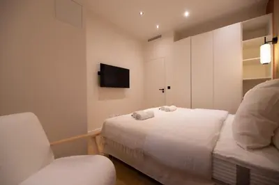 Un ou plusieurs lits dans un hébergement de l'établissement 2Cozy1BR#Exhibition Centre