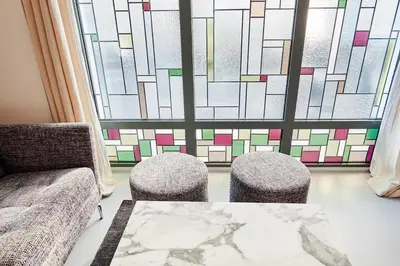 Coin salon dans l'établissement Grand studio pour 4p Paris 14
