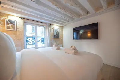 Un ou plusieurs lits dans un hébergement de l'établissement 1BR#Turenne#Place des Vosges