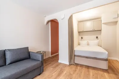 Un ou plusieurs lits dans un hébergement de l'établissement Studio Cozy Design - Batignolles
