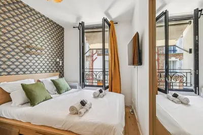 Un ou plusieurs lits dans un hébergement de l'établissement Double Apartment l 15min from Eiffel Tower by Car