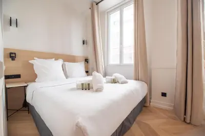 Un ou plusieurs lits dans un hébergement de l'établissement Bastille - Crémieux Residence