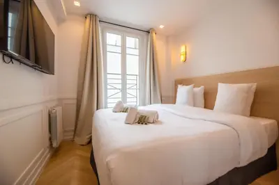 Un ou plusieurs lits dans un hébergement de l'établissement Relax in Paris XII