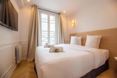 Un ou plusieurs lits dans un hébergement de l'établissement Relax in Paris XII