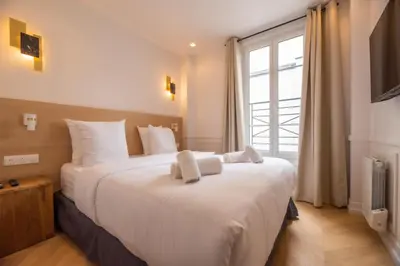 Un ou plusieurs lits dans un hébergement de l'établissement Lovely Flat near Rue Crémieux & Bastille