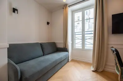 Télévision ou salle de divertissement dans l'établissement Cute one bedroom Flat near Bastille