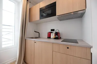 Cuisine ou kitchenette dans l'établissement Cute one bedroom Flat near Bastille
