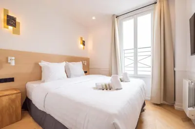 Un ou plusieurs lits dans un hébergement de l'établissement Cute one bedroom Flat near Bastille