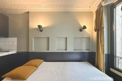 Un ou plusieurs lits dans un hébergement de l'établissement Flexliving - Studio - Manuel