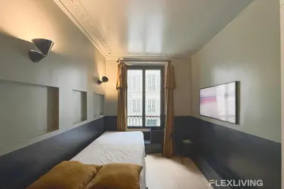 Un ou plusieurs lits dans un hébergement de l'établissement Flexliving - Studio - Manuel