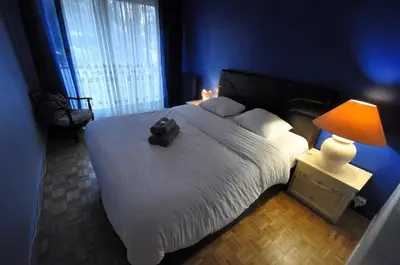 Un ou plusieurs lits dans un hébergement de l'établissement Spacieux appartement pour 6, à Parc de la Villette