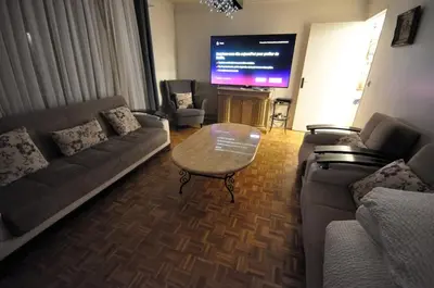 Coin salon dans l'établissement Spacieux appartement pour 6, à Parc de la Villette
