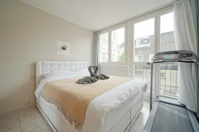 Un ou plusieurs lits dans un hébergement de l'établissement appartement saint ouen sur Seine