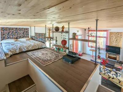 Télévision ou salle de divertissement dans l'établissement Le Penthouse de Boulogne entre la Seine et le Jardin