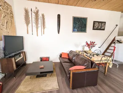 Télévision ou salle de divertissement dans l'établissement Le Penthouse de Boulogne entre la Seine et le Jardin