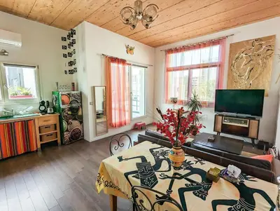Télévision ou salle de divertissement dans l'établissement Le Penthouse de Boulogne entre la Seine et le Jardin