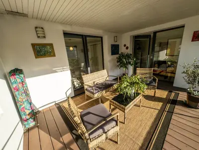 Coin salon dans l'établissement Chambre-Salon avec Terrasse sur Jardin