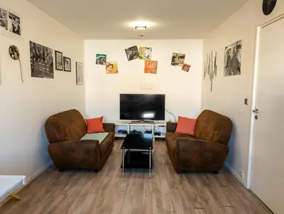 Coin salon dans l'établissement Chambre-Salon avec Terrasse sur Jardin