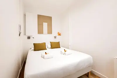 Un ou plusieurs lits dans un hébergement de l'établissement Appartement proche Tour Eiffel