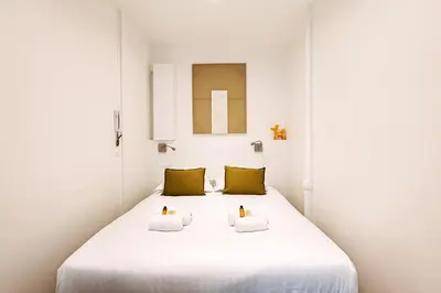 Un ou plusieurs lits dans un hébergement de l'établissement Appartement proche Tour Eiffel