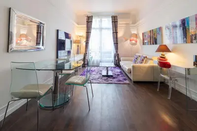 Un ou plusieurs lits dans un hébergement de l'établissement Appartement Champs Elysées