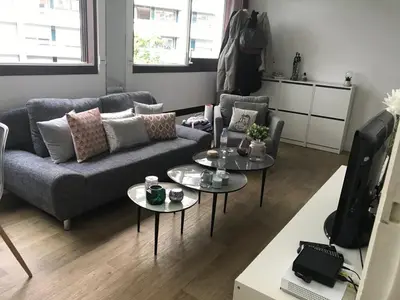 Coin salon dans l'établissement Grand studio fonctionnel, calme et ensoleillé