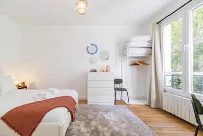 Un ou plusieurs lits dans un hébergement de l'établissement Guersant - Maison cosy 6PAX proche Etoile