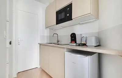 Cuisine ou kitchenette dans l'établissement MyKeypers - Lovely Studio 2P - Malakoff 12