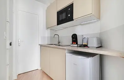 Cuisine ou kitchenette dans l'établissement MyKeypers - Lovely Studio 2P - Malakoff 12
