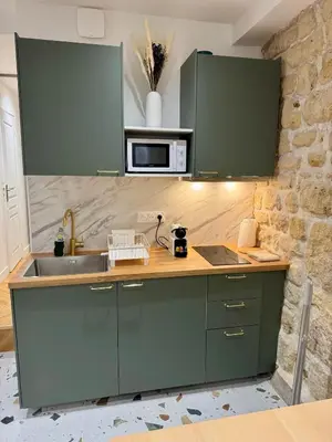 Cuisine ou kitchenette dans l'établissement Séjour magique au cœur de Paris