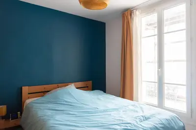 Un ou plusieurs lits dans un hébergement de l'établissement Apartment of 26 m2 near the park of Belleville
