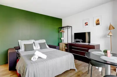 Un ou plusieurs lits dans un hébergement de l'établissement Eiffel residence Gustave